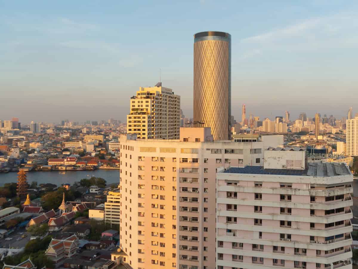 aerial view of bangkok downtown skyline, thailand. financial district and business centers in smart urban city in asia. skyscraper and high rise buildings at sunset.