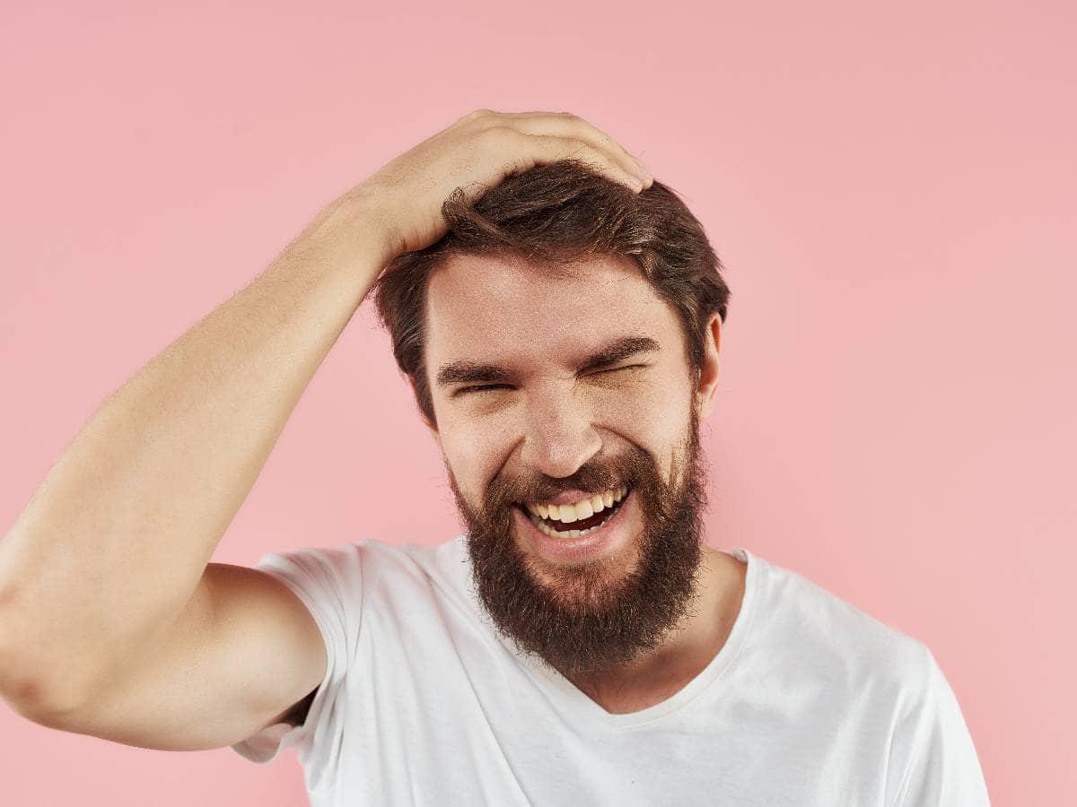 FUE vs DHI Hair Transplant - Which Method Wins for You bearded man in a white t shirt hand gestures studi 2026 01 09 00 28 09 utc