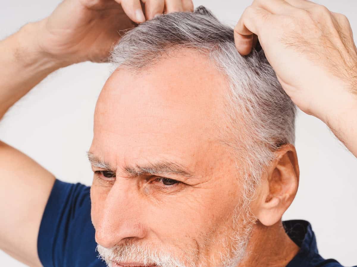 close up portrait of senior gray haired man with h 2026 03 19 02 10 52 utc