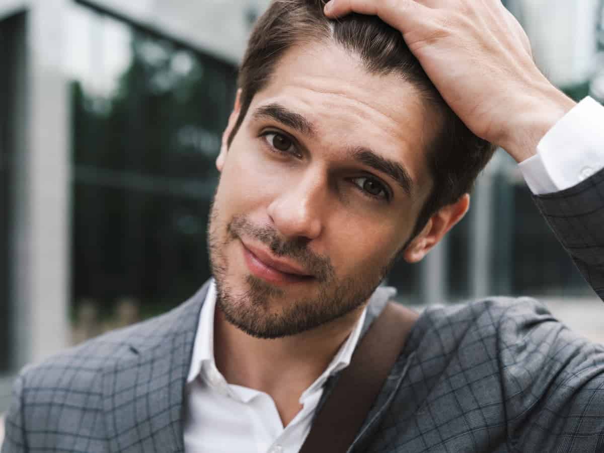 When Can You Really Go Back to Work After a Hair Transplant? handsome business man outdoors near business cente 2026 01 08 01 40 53 utc