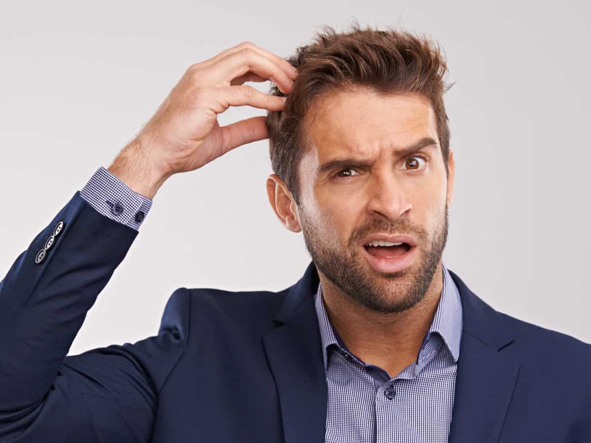 Questions to Ask Before Getting a Hair Transplant Abroad lots of head scratching is going on studio shot o 2026 03 25 03 33 39 utc 1920x1317