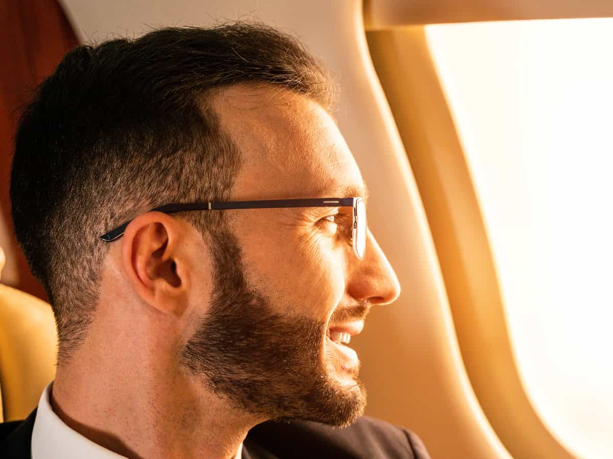 businessman flying on private jet