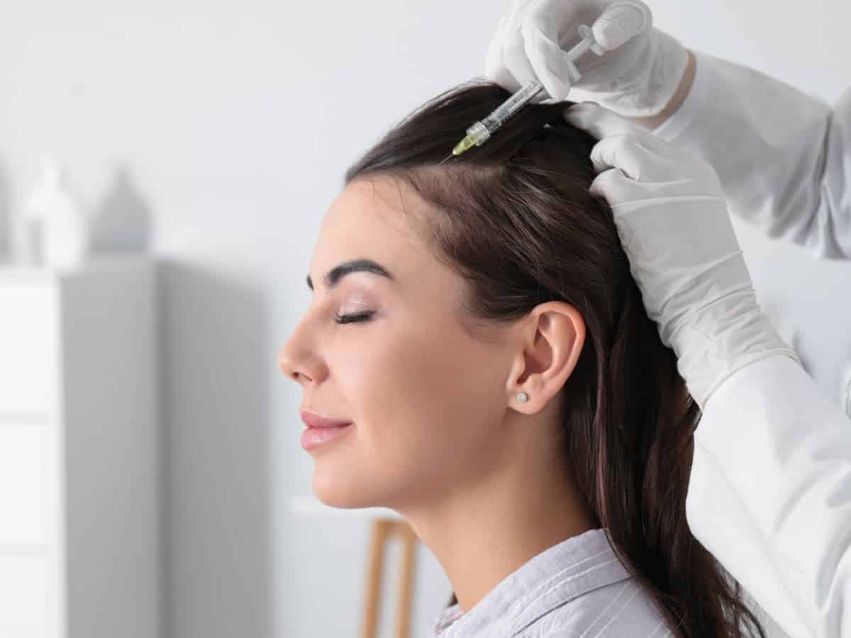 Hair Transplant for Women That Looks Natural and Feels Right woman receives scalp treatment in clinic environme 2026 03 18 22 09 06 utc (1)