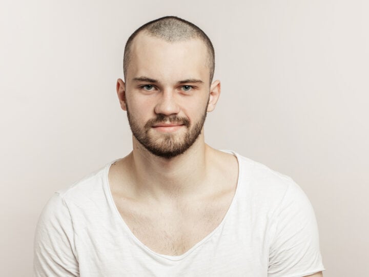 young man in white t shirt posing indoors 2026 03 25 23 40 54 utc